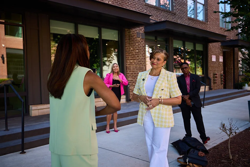 Roslyn being filmed on the street during a content shoot